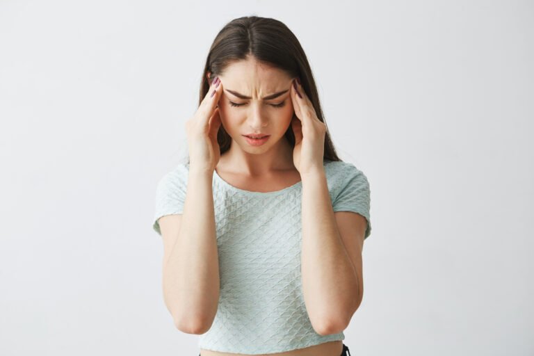 young-beautiful-brunette-girl-frowning-touching-temples-headache-isolated-white-background-1