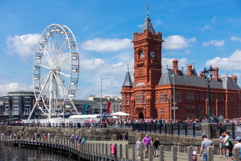 UK - JULY 7 : View of the Ferris wheel and the Pierhead Building in Cardiff on July 7, 2019